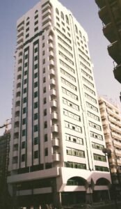 High-rise office building with contemporary architecture in an urban setting.