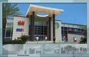 Contemporary shopping mall entrance with retail stores and Starbucks.